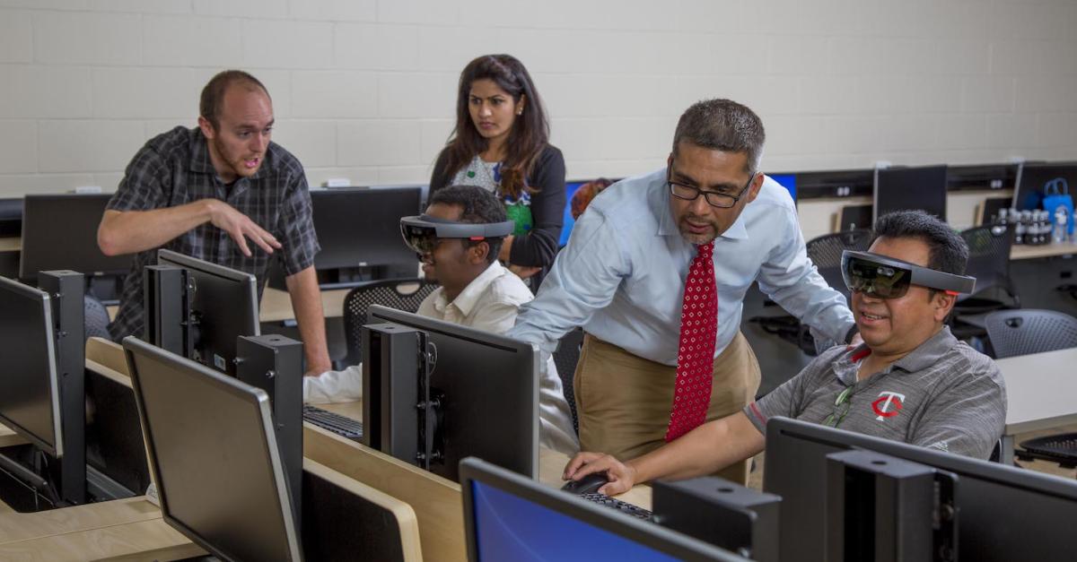 faculty and students in computer lab with virtual reality headsets