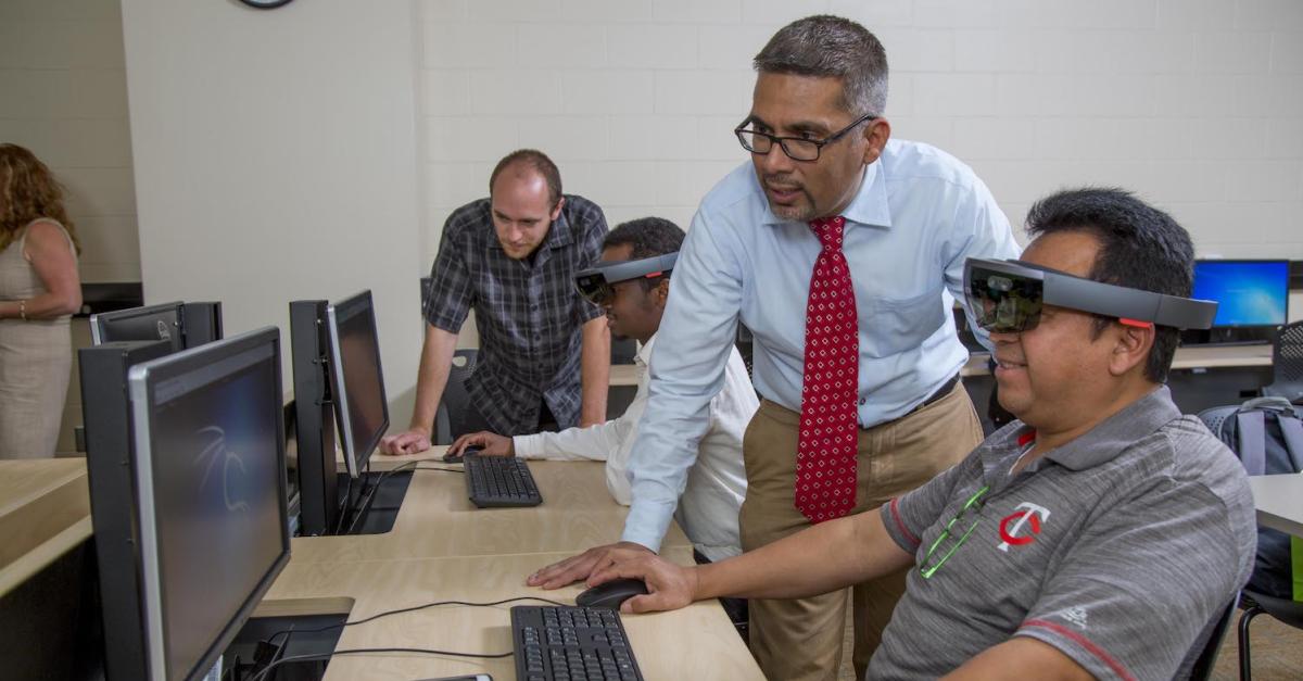 faculty and students in cybersecurity lab