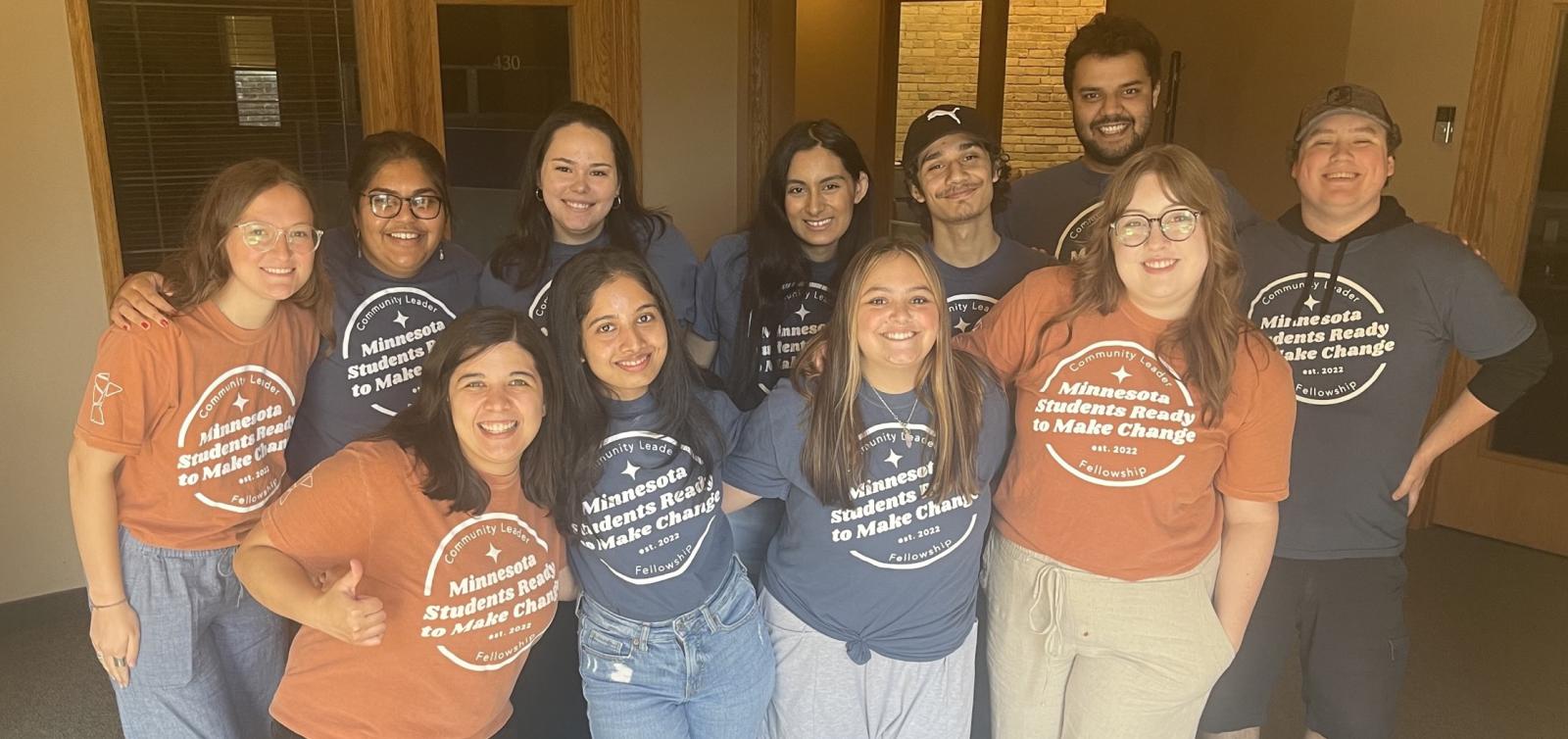 A group of students and staff pose for a picture