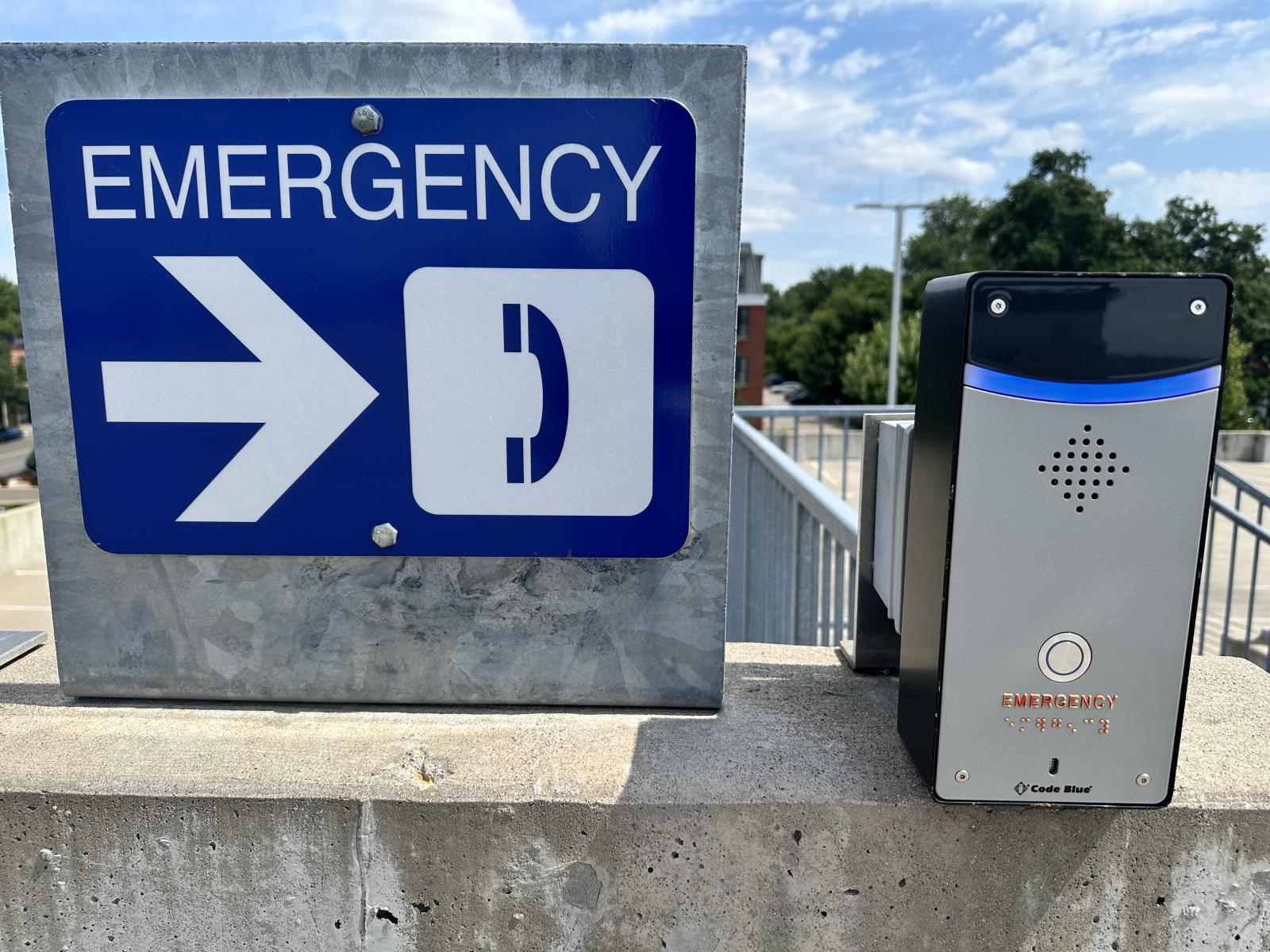 Image of Blue Phones next to Emergency sign