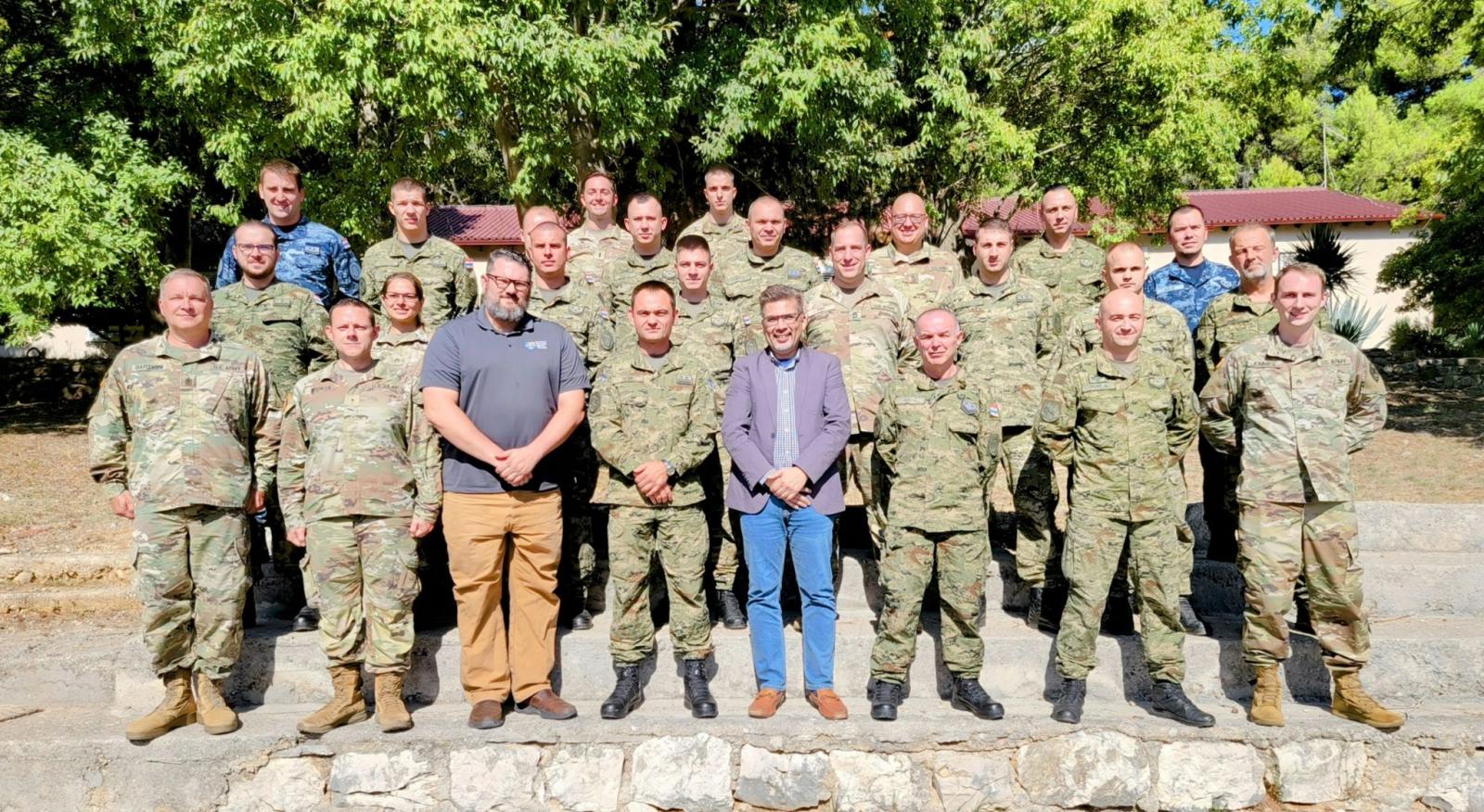 Croatian military personnel, MN National Guard members, and cyber security professionals pose for a group picture at a base in Mali Lošinj, Croatia