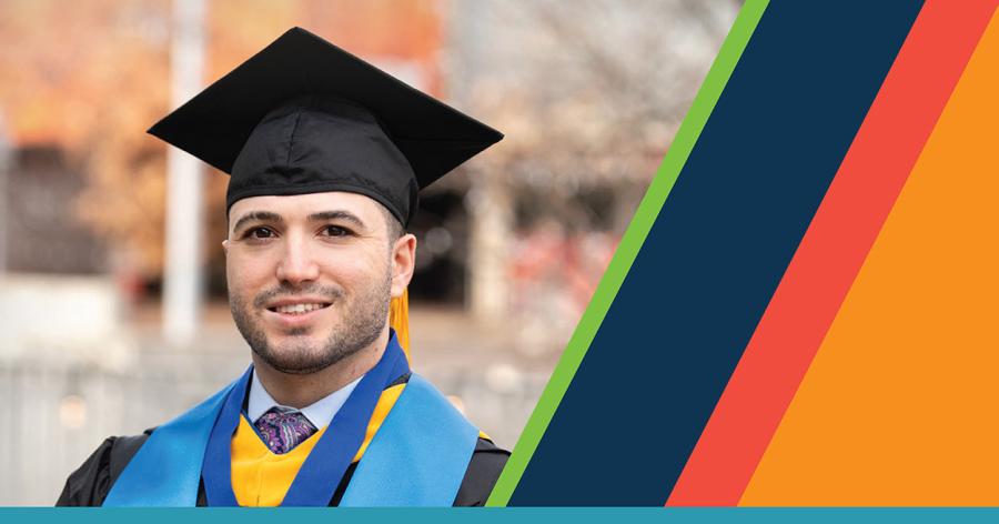 A person in cap and gown posing for a portrait next to diagonal color stripes